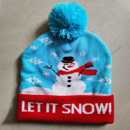 360 HOME CHRISTMAS HAT ELECTRIC BEANIE STYLE KNITTED MATERIAL SNOWMAN+FLKES ON BLUE BASE+POMPOM+RED BRIM "LET IT SNOW"
